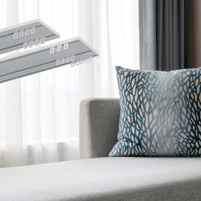 Layered curtains operated by a motorised track in a modern room